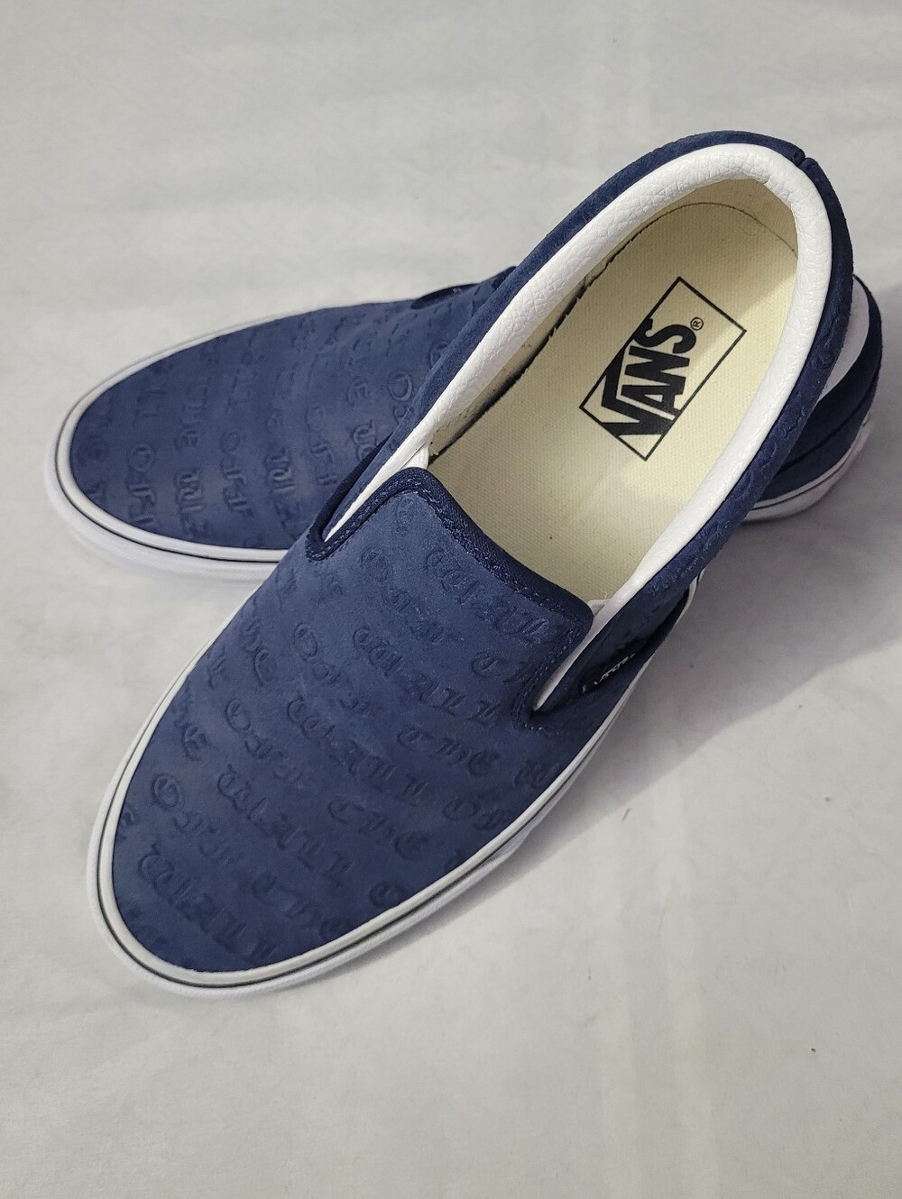 Vans Men's Slip-On Shoes in Navy with White Trim